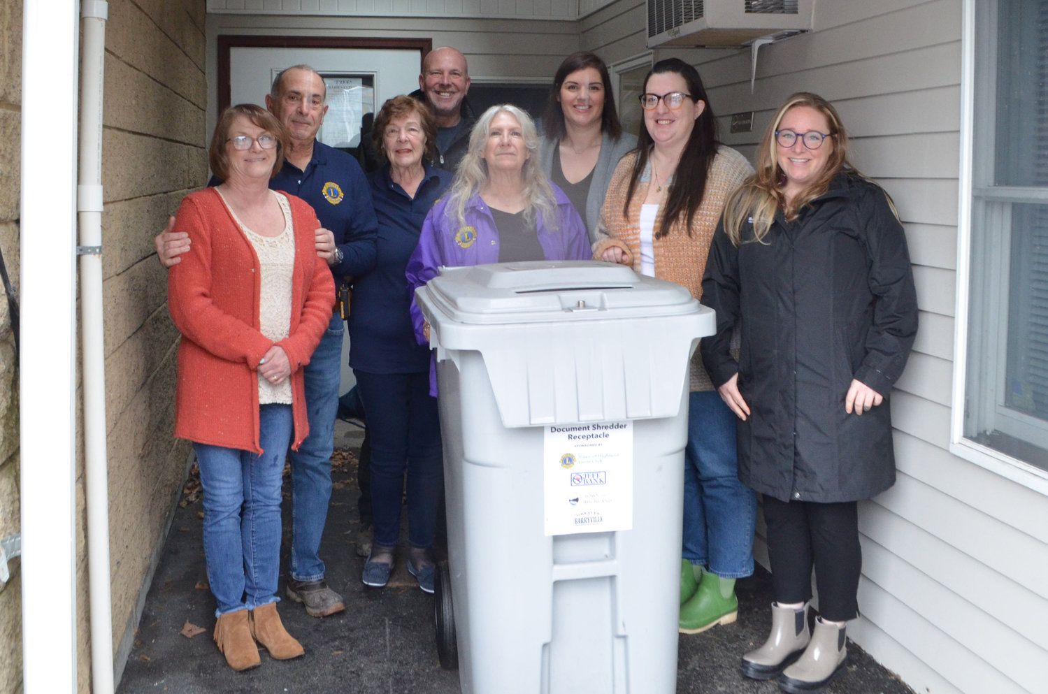 Representing the donors behind the Town of Highland shredder project, town clerk Sue Hoffman, left, Lions Club members Tony LaRuffa and Karen Flowers, town council member Chris Tambini, Lions Club president Claudia Bocker, Jeff Bank representative Jill Bertot, town council member Kaitlin Haas and Greater Barryville Chamber of Commerce secretary Laura Burrell.